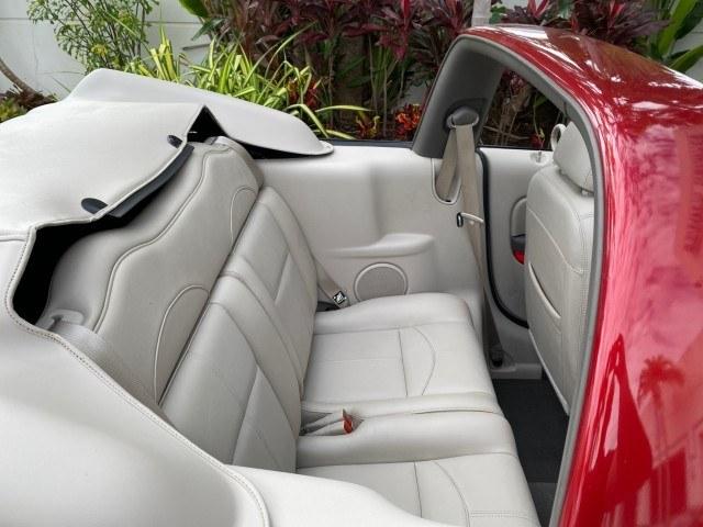 2005 Inferno Red Crystal Pearl /Taupe/Pearl Beige Chrysler PT Cruiser Touring CONV LOW MILES 34,462 (3C3AY55E85T) with an 2.4L DOHC SMPI 16-Valve I4 Engine engine, Automatic transmission, located at 4701 North Dixie Hwy, Pompano Beach, FL, 33064, (954) 422-2889, 26.240938, -80.123474 - OUR WEBPAGE FLORIDACARS1.COM HAS OVER 100 PHOTOS AND FREE CARFAX LINK 2005 Chrysler PT Cruiser Touring Convertible 2.4L I4 F DOHC 16V Gasoline 29 MPG Front Wheel Drive Features ABS Brakes Air Conditioning Alloy Wheels AM/FM Stereo Automatic Transmission Cassette Player CD Audio Cruise Control Leathe- Photo#79