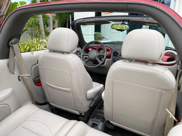 2005 Inferno Red Crystal Pearl /Taupe/Pearl Beige Chrysler PT Cruiser Touring CONV LOW MILES 34,462 (3C3AY55E85T) with an 2.4L DOHC SMPI 16-Valve I4 Engine engine, Automatic transmission, located at 4701 North Dixie Hwy, Pompano Beach, FL, 33064, (954) 422-2889, 26.240938, -80.123474 - OUR WEBPAGE FLORIDACARS1.COM HAS OVER 100 PHOTOS AND FREE CARFAX LINK 2005 Chrysler PT Cruiser Touring Convertible 2.4L I4 F DOHC 16V Gasoline 29 MPG Front Wheel Drive Features ABS Brakes Air Conditioning Alloy Wheels AM/FM Stereo Automatic Transmission Cassette Player CD Audio Cruise Control Leathe- Photo#80