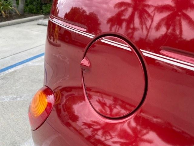 2005 Inferno Red Crystal Pearl /Taupe/Pearl Beige Chrysler PT Cruiser Touring CONV LOW MILES 34,462 (3C3AY55E85T) with an 2.4L DOHC SMPI 16-Valve I4 Engine engine, Automatic transmission, located at 4701 North Dixie Hwy, Pompano Beach, FL, 33064, (954) 422-2889, 26.240938, -80.123474 - OUR WEBPAGE FLORIDACARS1.COM HAS OVER 100 PHOTOS AND FREE CARFAX LINK 2005 Chrysler PT Cruiser Touring Convertible 2.4L I4 F DOHC 16V Gasoline 29 MPG Front Wheel Drive Features ABS Brakes Air Conditioning Alloy Wheels AM/FM Stereo Automatic Transmission Cassette Player CD Audio Cruise Control Leathe- Photo#86