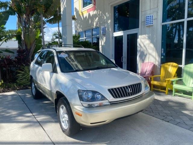 1999 Desert Bronze Metallic /Ivory Lexus RX 300 Luxury SUV LOW MILES 62,417 1 OWNER (JT6GF10U6X0) with an 3.0L Aluminum 24-Valve V6 Engine engine, Automatic transmission, located at 4701 North Dixie Hwy, Pompano Beach, FL, 33064, (954) 422-2889, 26.240938, -80.123474 - OUR WEBPAGE FLORIDACARS1.COM HAS OVER 100 PHOTOS AND FREE CARFAX LINK 1999 Lexus RX 300 1 OWNER 4 Door Wagon/Sport Utility 3.0L V6 F 24V Gasoline 24 MPG Front Wheel Drive Features ABS Brakes Air Conditioning Alloy Wheels AM/FM Stereo Automatic Transmission Cassette Player Cruise Control Full Roof Ra- Photo#1